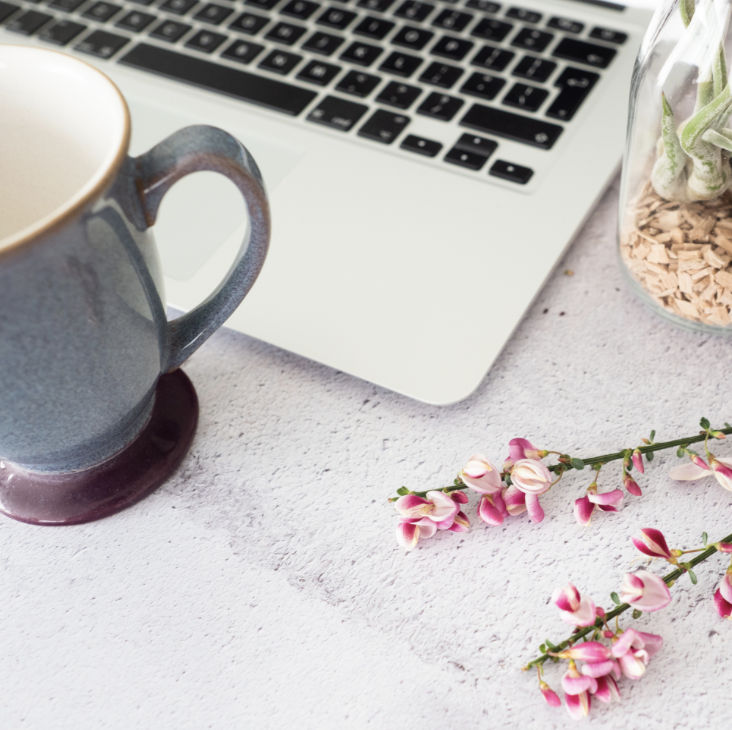 laptop and mug on desk