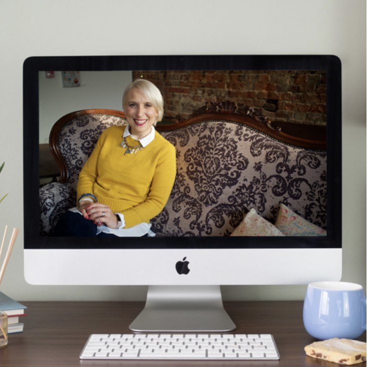 Woman smiling on computer screen