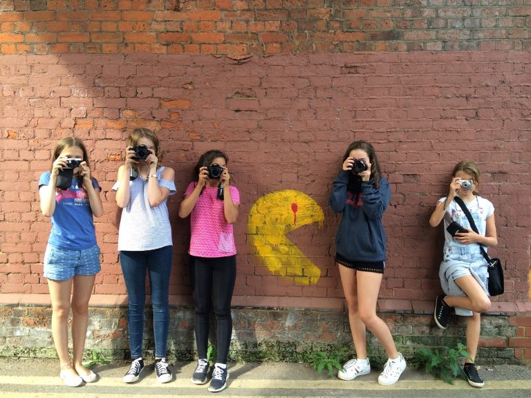 Teenagers taking pictures on photography workshop in Guildford, Surrey